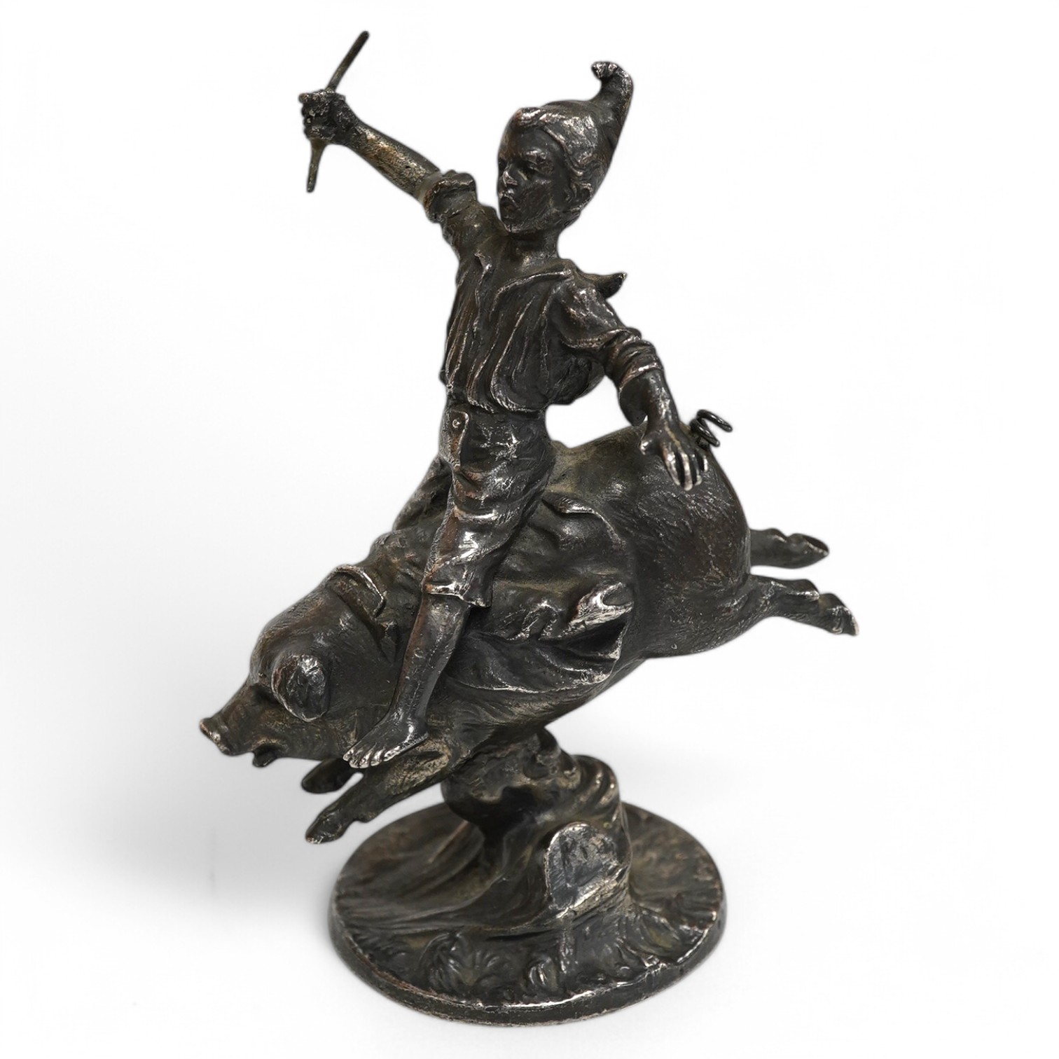 An early 20th century car mascot designed by Franz Bergmann ‘Boy riding a pig’, 12.5cm high. Condition - good, missing a small section in the right hand